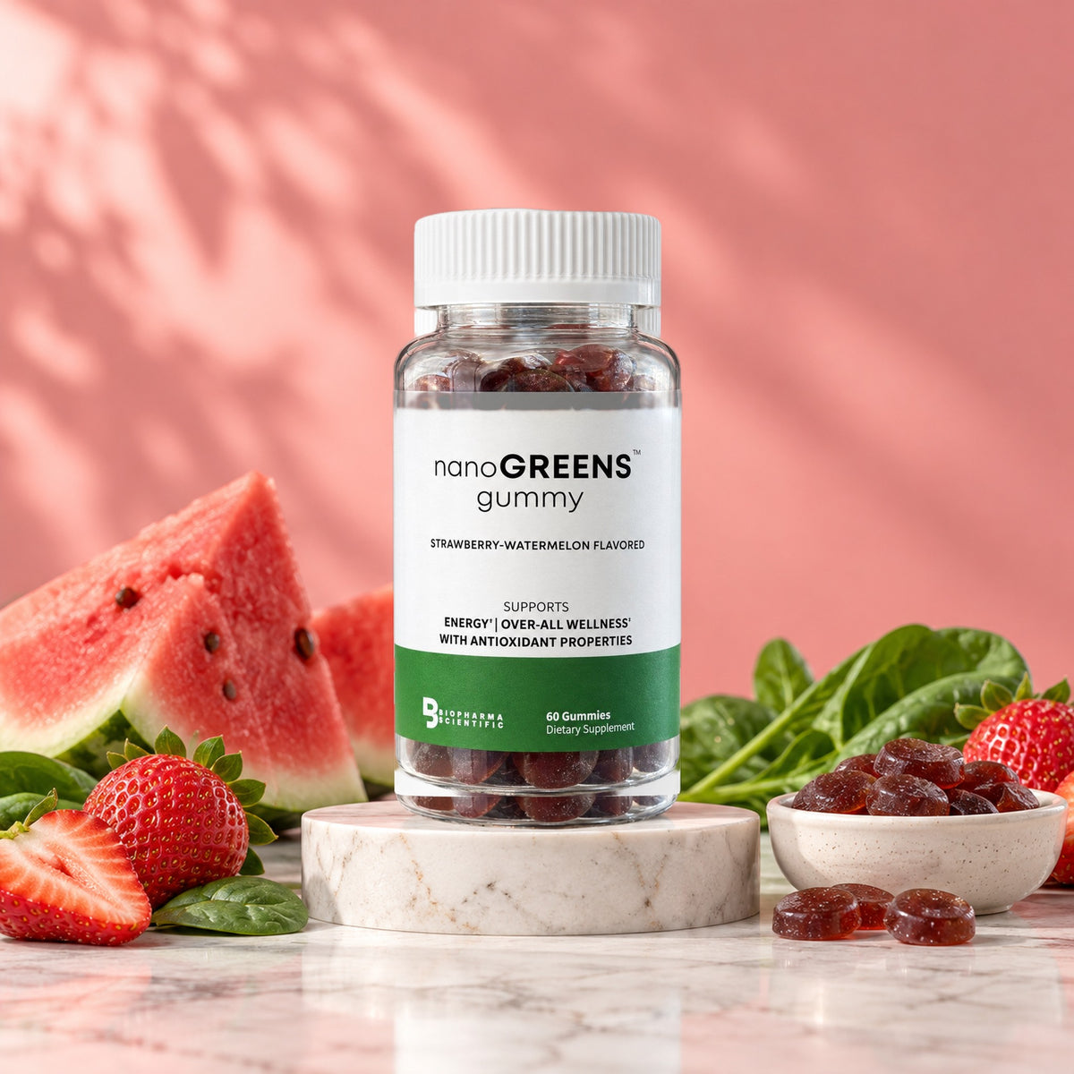 NanoGreens Gummies Strawberry-Watermelon jar in a bright studio still life with fresh ingredients