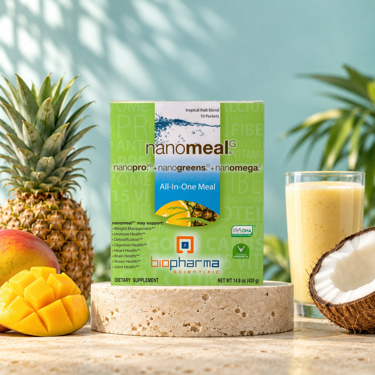 NanoMeal Tropical Blend carton in a bright studio still life with fresh ingredients