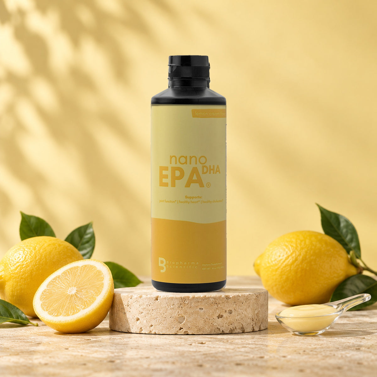 NanoEPA DHA Lemon Cream bottle in a bright studio still life with fresh ingredients