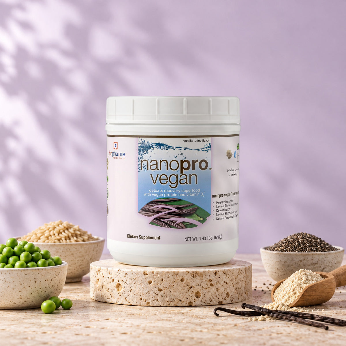 NanoPro Vegan tub in a bright studio still life with fresh ingredients